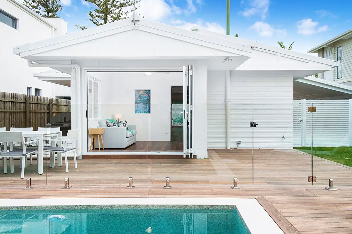 a white poolfront house